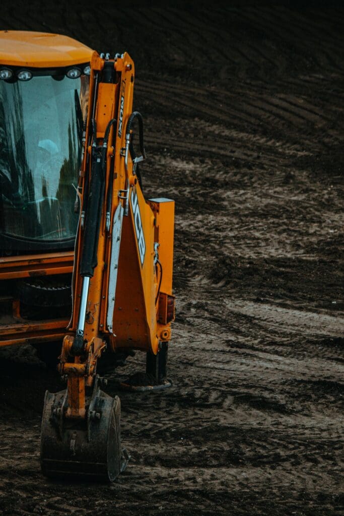 Industrial construction excavator completing site development work in Reno